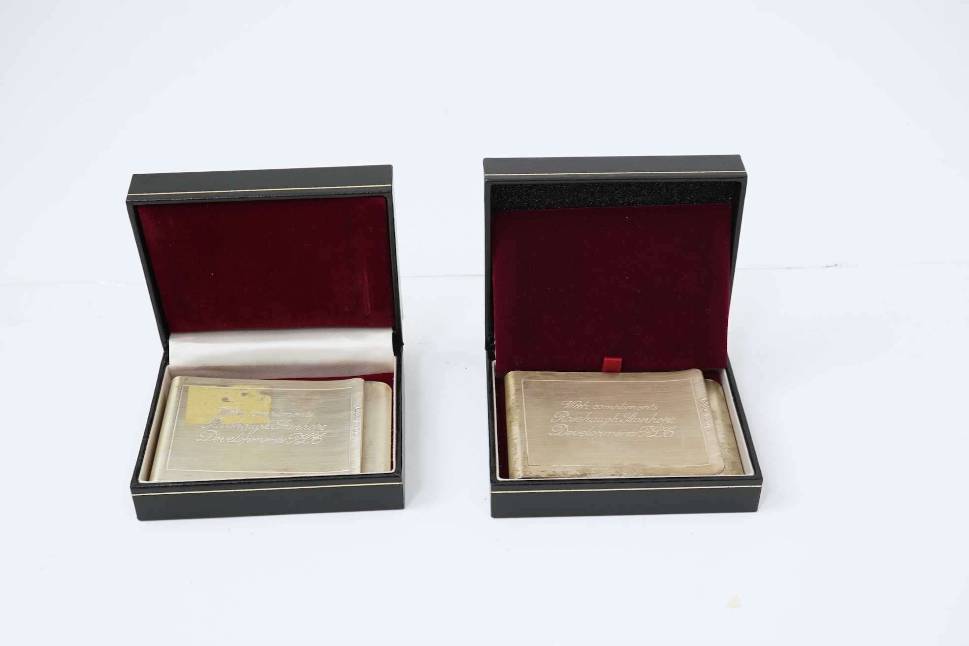 A pair of Elizabeth II silver money clips by Adrian Gerald Benney